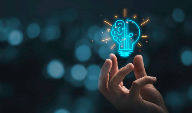 Hand holding drawing virtual lightbulb with brain on bokeh background for creative and smart thinking idea concept for Corporate Due Diligence